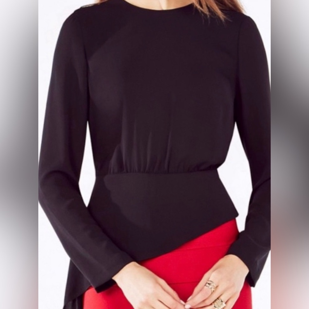 BCBG “Eugenie” asymmetrical peplum top with long sleeves and open back.